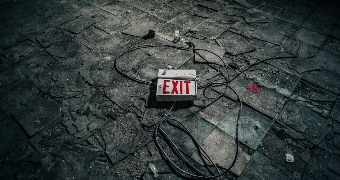 Phot of a broken exist sign